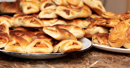 Buns with raisins and jam in a plate