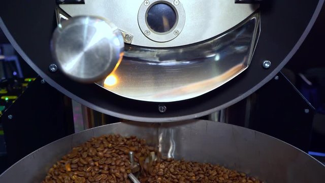 Cooling coffee beans after roasting. Roasting machine, close-up
