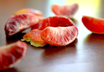 Blood Orange Segments on Wood Table