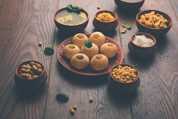 Pani Puri is Indian chat item served in a terracotta bowls and plate   © StockImageFactory