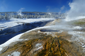 Blue river and colourful volcanic lake, winter in Yellowstone National Park, Wyoming, United States