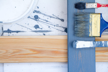 Art background. Brushes for painting on wooden canvas