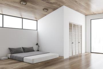 White and wooden bedroom corner