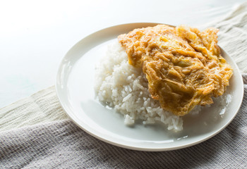 Omelet on white rice.