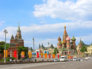 Russia, Moscow. The capital is decorated for the Victory Day holiday. Colorful flags on the streets. Center of the russian capital: Kremlin, Red Square, Spasskaya Tower, St. Basil's Cathedral.