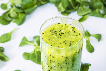 kiwi smoothie and vegetables  isolated on white