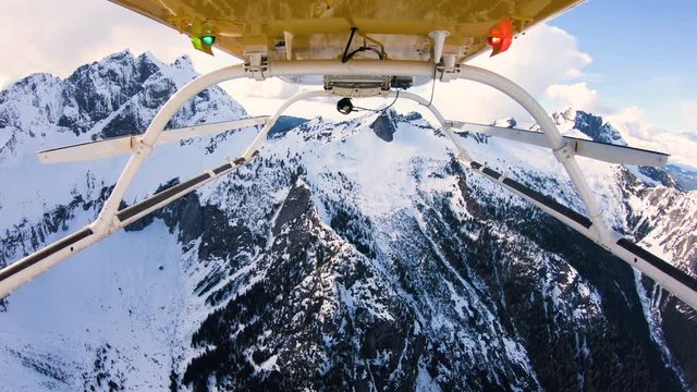 High Altitude Helicopter Flying in Mountains Snowy Peak Background Three Fingers Washington USA