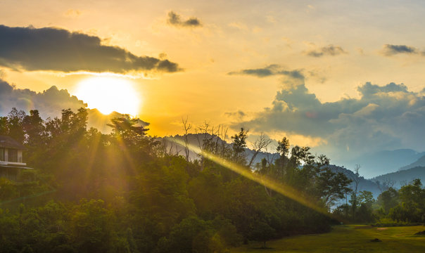 Sunrise at KUALA KUBU BHARU rest house. The sun burst has touched the golf field in front of the rest house. Images MAY or COULD have under or overexpose effect also noise and grain.