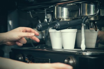waiter preparing coffee at the bar
