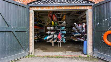 Colourful canoes in a boatshed in Richmond, London