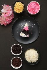 Strawberry milk cake on black background