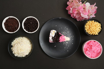 Strawberry milk cake on black background