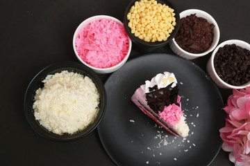 Strawberry milk cake on black background