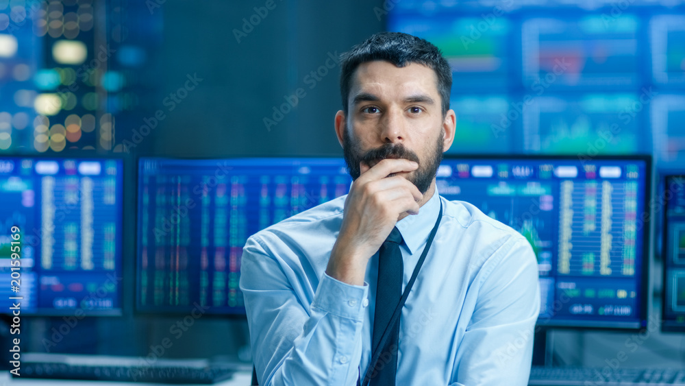 Poster stock market top trader thinking hard on selling stocks at the best time. behind him people working 