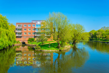 View of residential houses alongside river Avon in Stratford, England