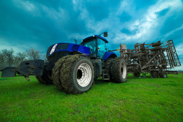large tractor with saddle wheels for agricultural work in the field