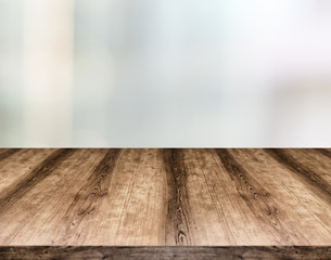 Wooden empty table board in front of blurred background. Can be used for display or montage any product. Mock up for display your product.