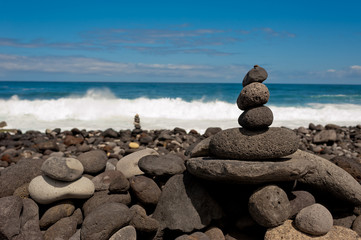 Stack of stones on the sea beach. Tenerife island.