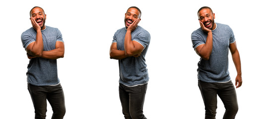 Obraz premium African american man with beard happy and surprised cheering expressing wow gesture