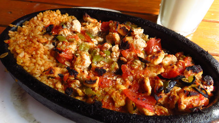 Traditional Turkish Chicken Kebab on Hot Stone Plate