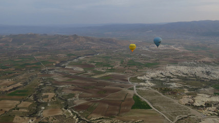 Yellow and Blue Hot Air Balloons Flying Over Cappadocia