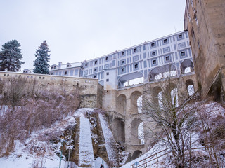 Historical houses and castle landmark  statue river winter season snow in Cesky Krumlov. Czech Republic