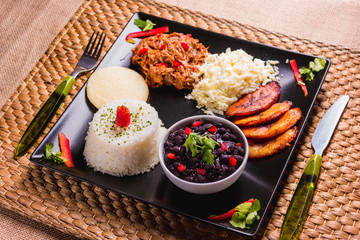 Pabellón criollo, Venezuelan food that has rice, meat, black beans, fried plantain and cheese