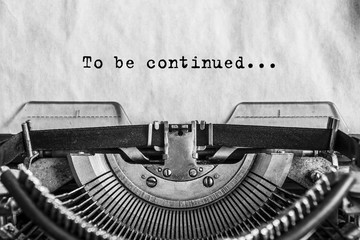 To be continued ... typed words on a Vintage Typewriter. Close-up. old paper
