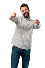 Fototapeta premium Handsome man with beard points finger at you