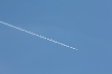 Plane on blue sky, background air transport.