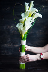 White calla lillies in bridal bouquet