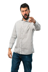 Handsome man with beard annoyed angry in furious gesture
