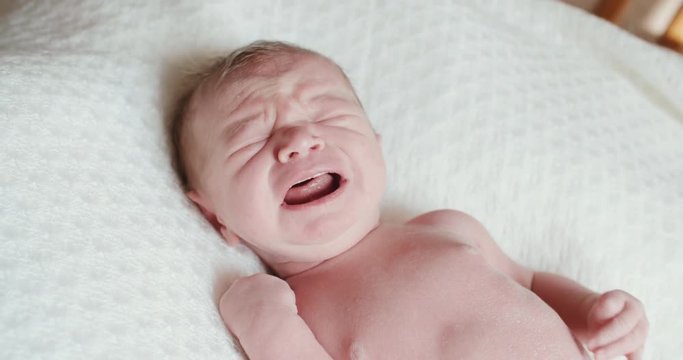 4k,Closeup of crying newborn baby, slow motion