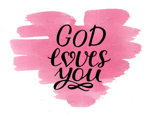 Hand lettering God loves you on watercolor pink heart