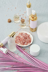 skincare beauty products concept image with pink palm leaf
