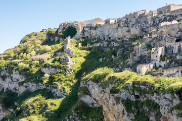 Fototapeta na wymiar Horizontal View of the Sassi of Matera on Blue Sky Background. Matera, South of Italy