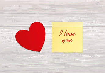 Red hearts with bow and ribbon. Yellow sheet of paper for notes.