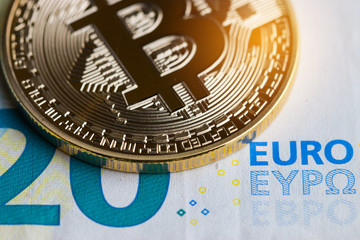 Bitcoin Cryptocurrency is Digital payment money Concept, Gold coins with B letter symbol,electronic circuit on EURO EYP20 bill.Cryptocurrency can uses designed work as medium of exchange in network