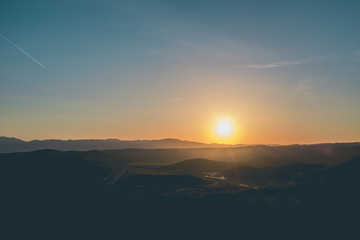 Sun over hills