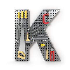 Letter K. Alphabet from the tools on the metal pegboard isolated on white.