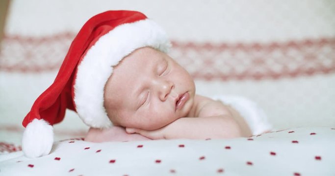 Close up, little baby sleep with Santa Claus hat