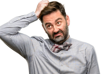 Middle age man, with beard and bow tie doubt expression, confuse and wonder concept, uncertain...