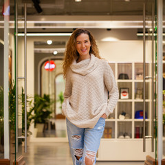 Portrait of a full length young beautiful curly blonde woman