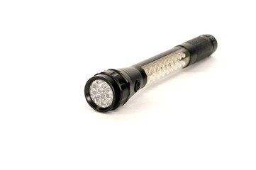 led flashlight black lies on white background