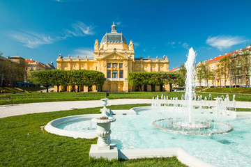 Obraz premium Art pavilion and fountain in Zagreb capital of Croatia, beautiful spring day, colorful architecture, outdoor 
