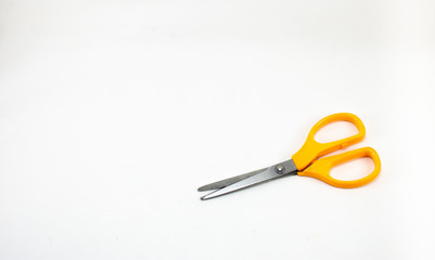 children's colorful scissors on a white background, for education.