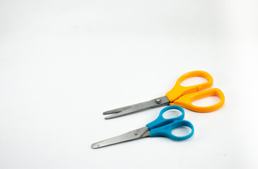 children's colorful scissors on a white background, for education.