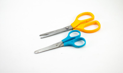 children's colorful scissors on a white background, for education.