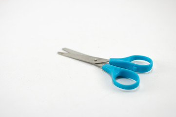 children's colorful scissors on a white background, for education.