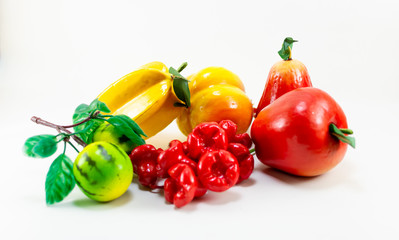 colorful plastic Toy fruits on white background